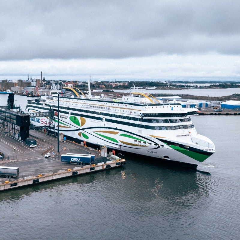Ferry sailing next to a bridge