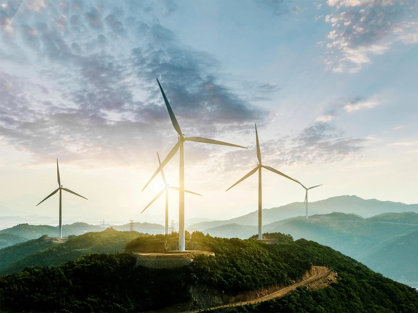 mood image of windmills on a hill