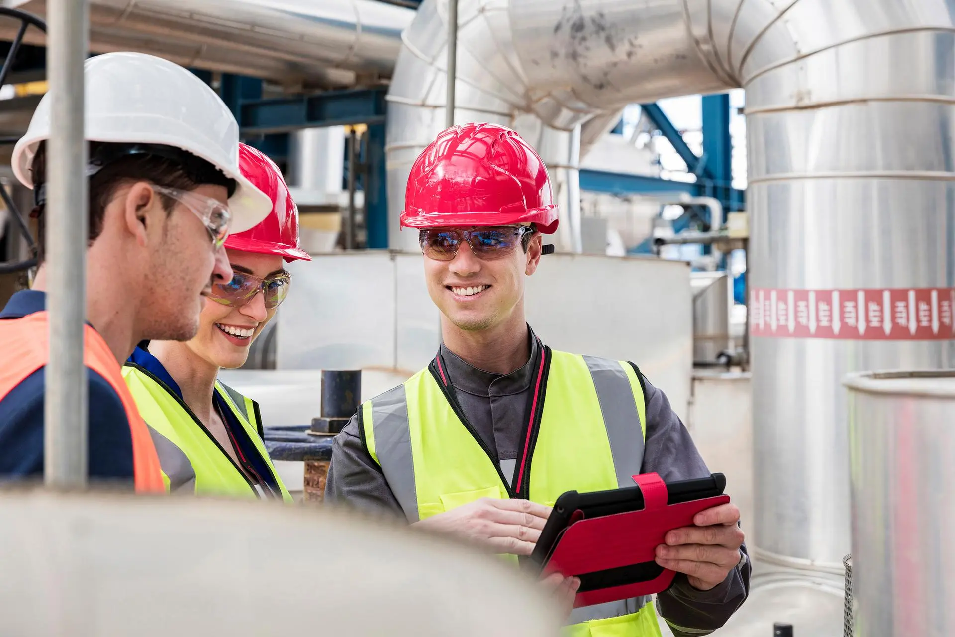 Engineers talking at a production site