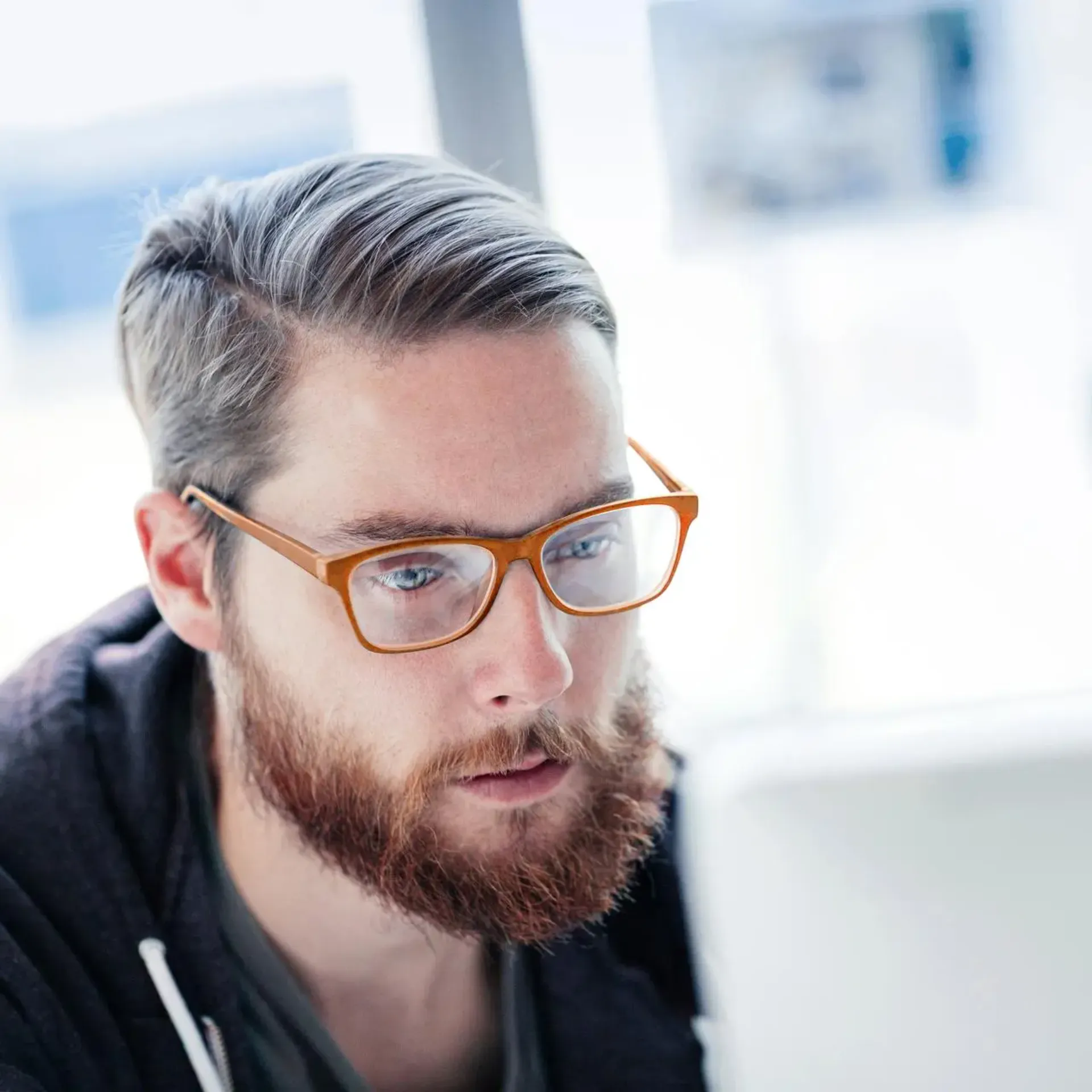 Man with glasses working in the office