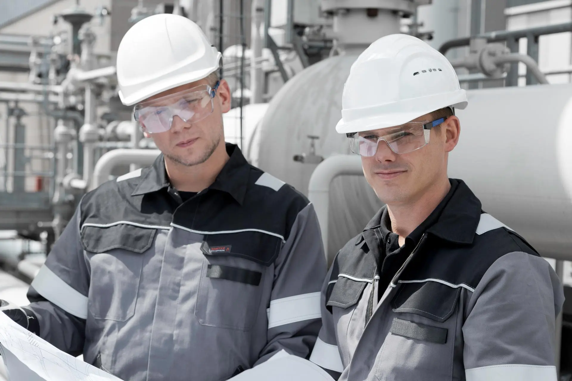 Two men working at a production site