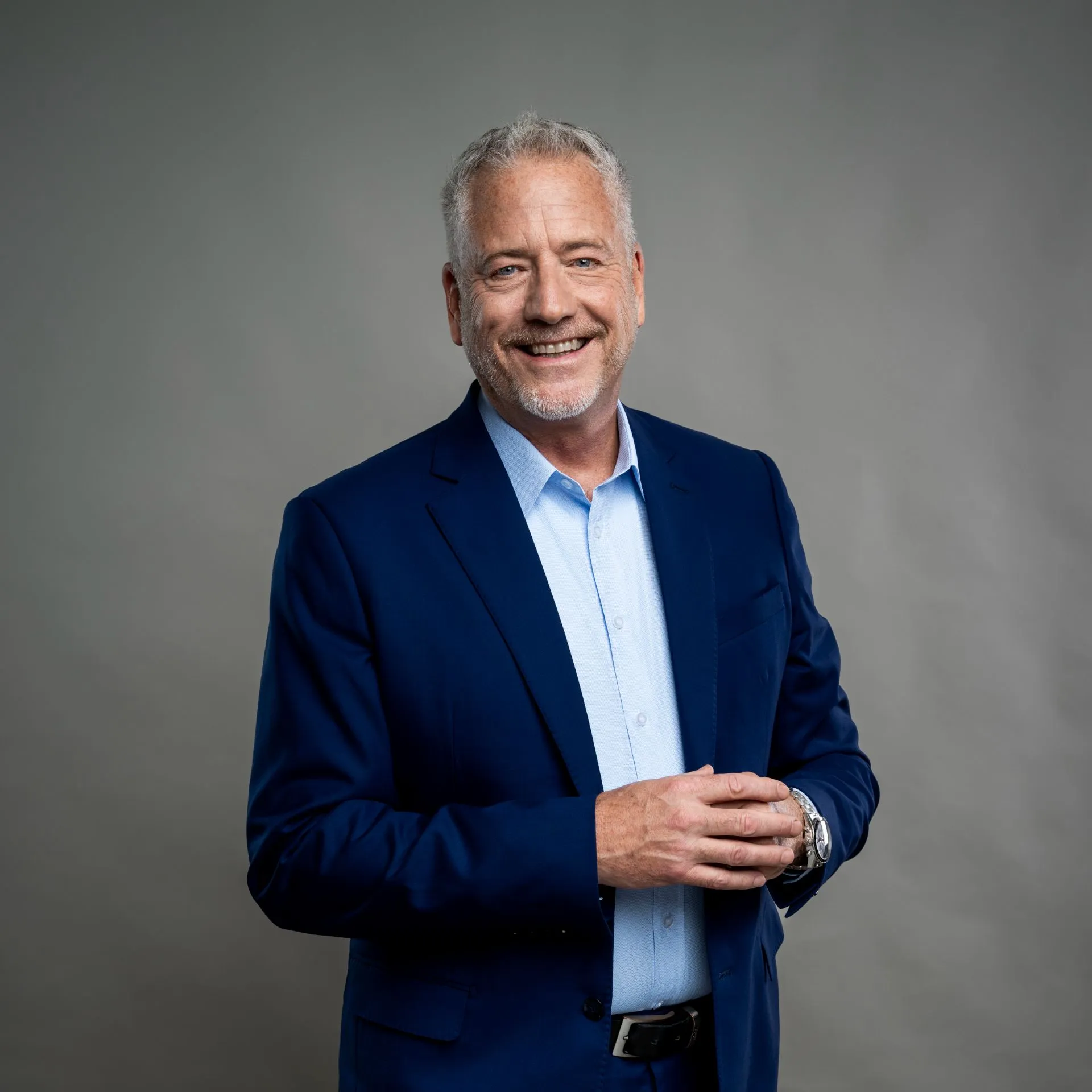 Man in a suit smiling