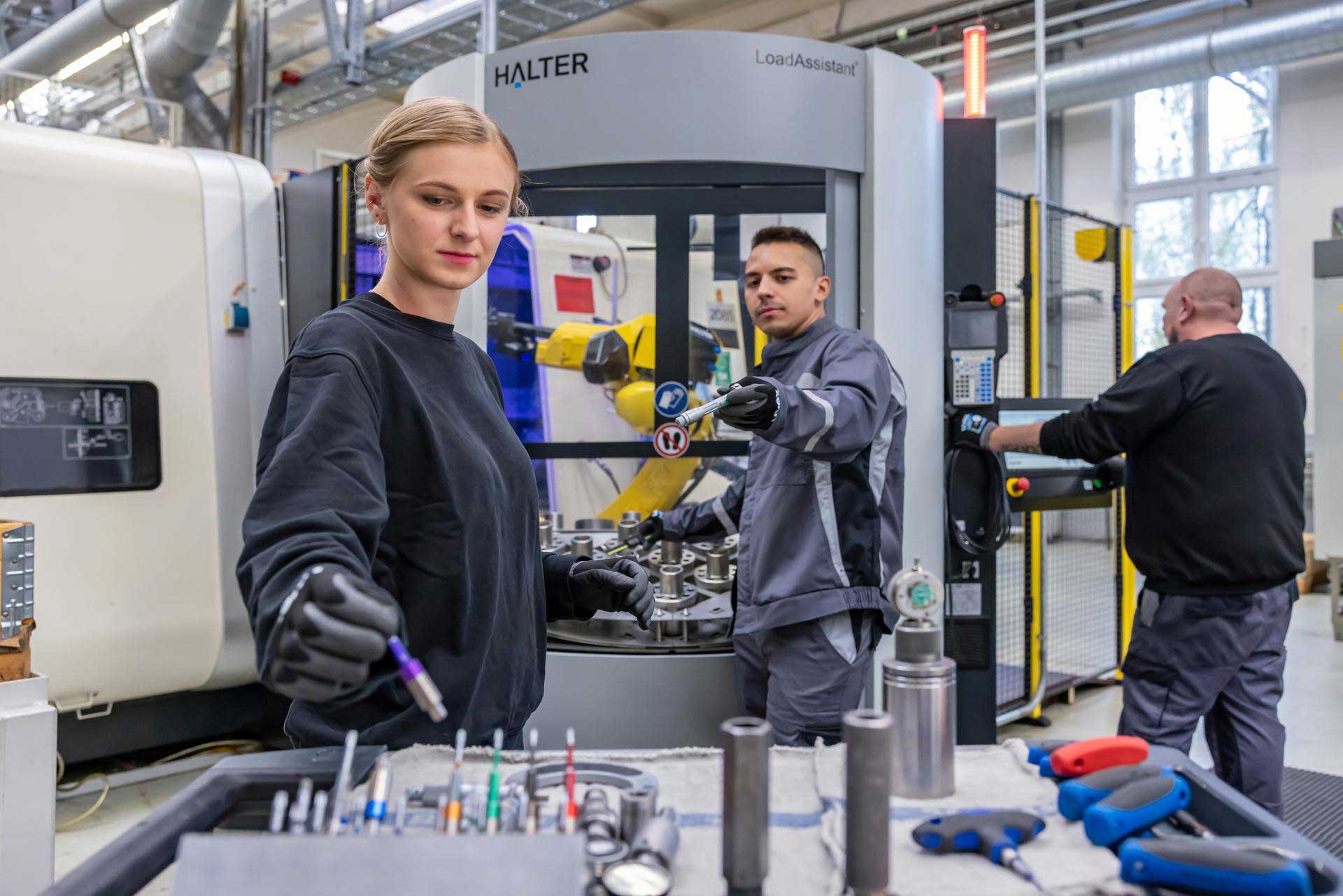 three people working in production