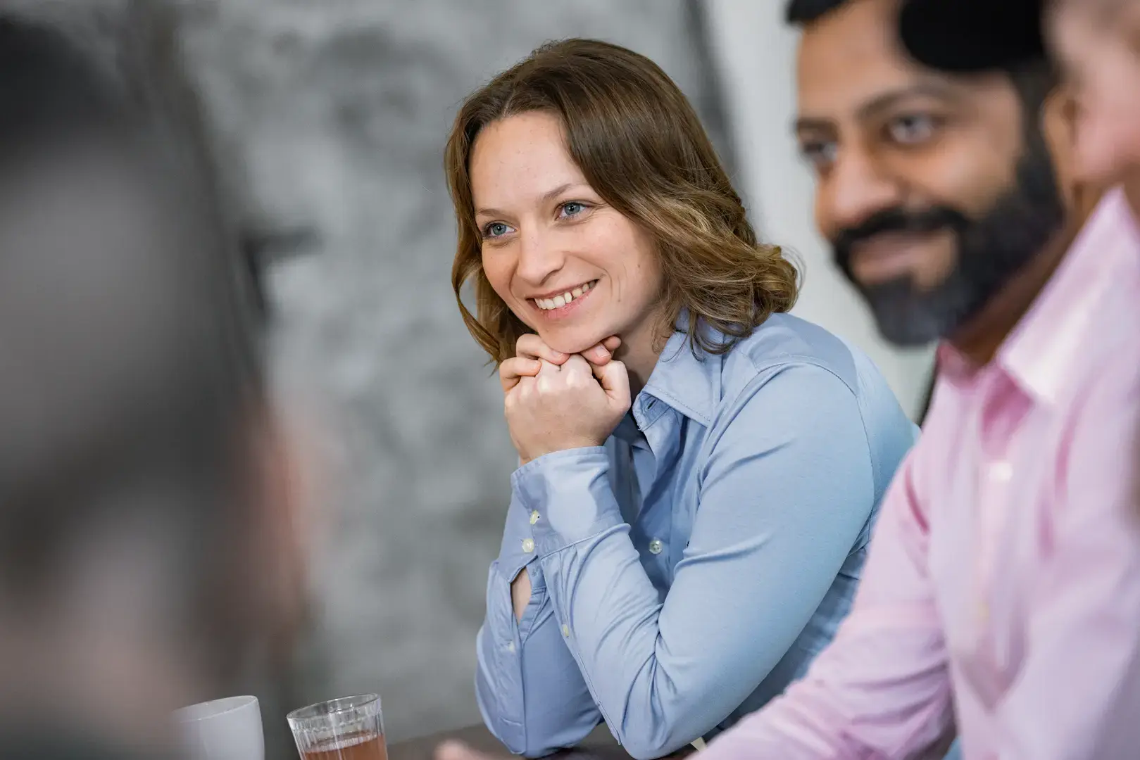 Portrait of smiling young man at the airport looking out of window