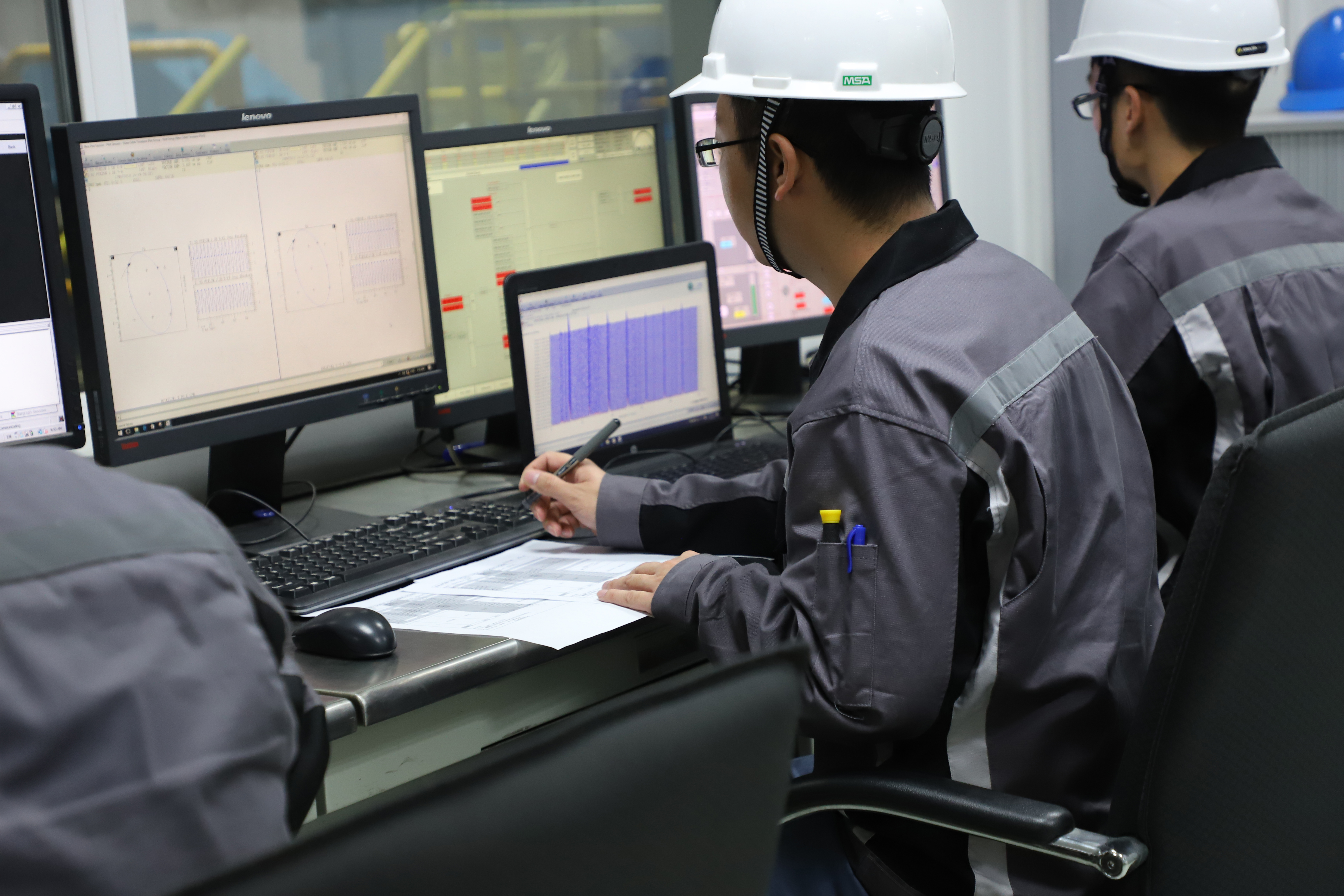 Two male test bed engineers