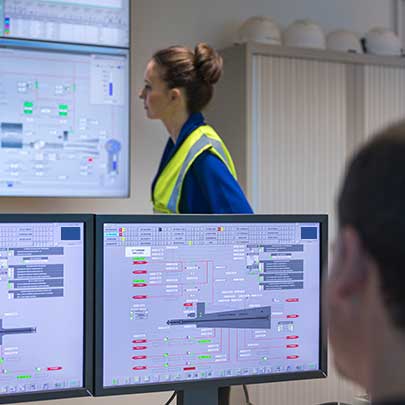employee looks at different screens