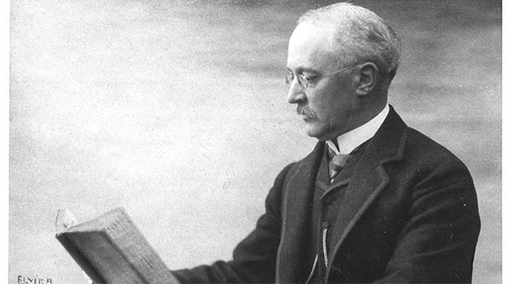 historical photograph of Rudolf Diesel reading in a book
