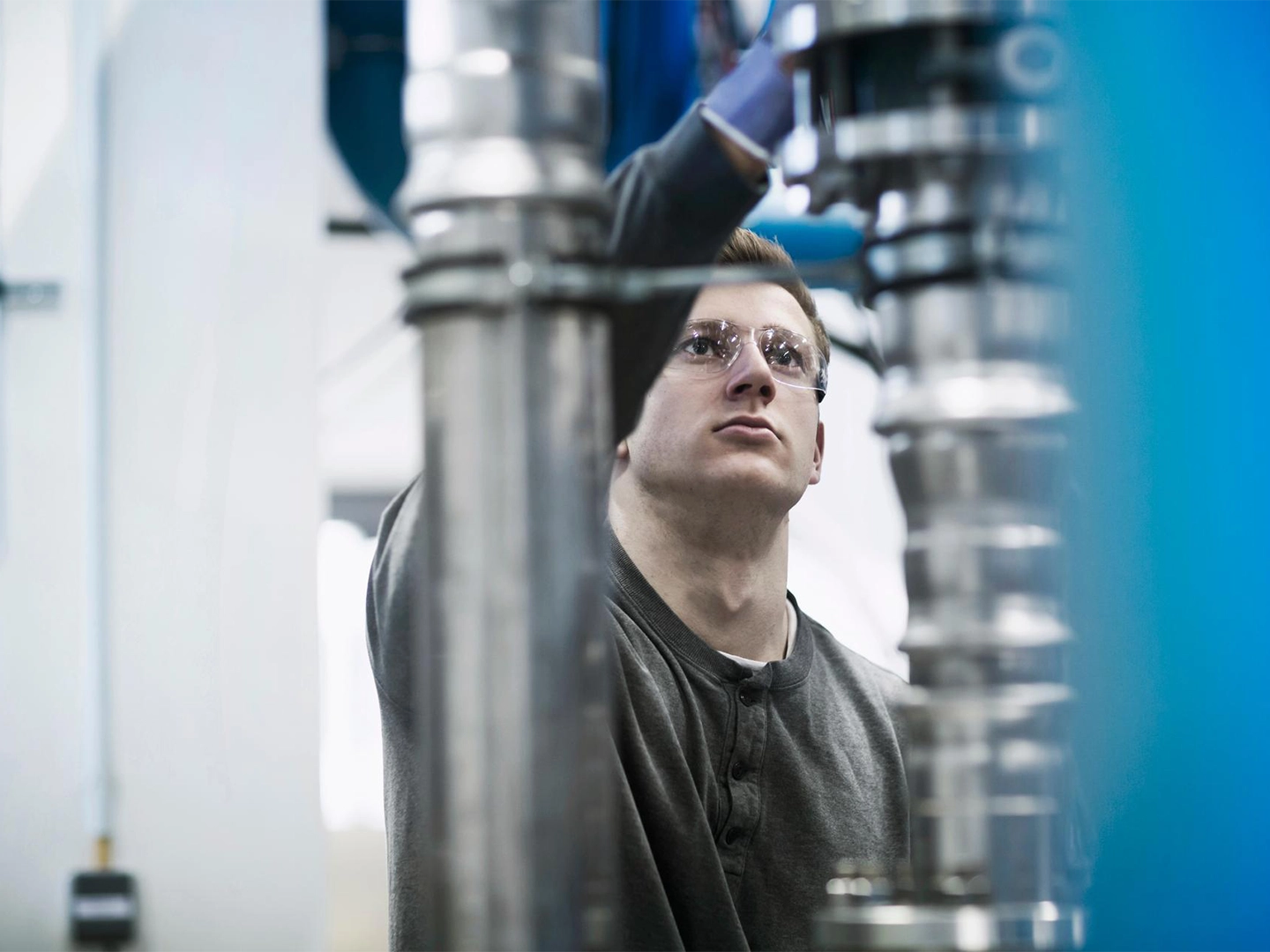 production employee working on an engine
