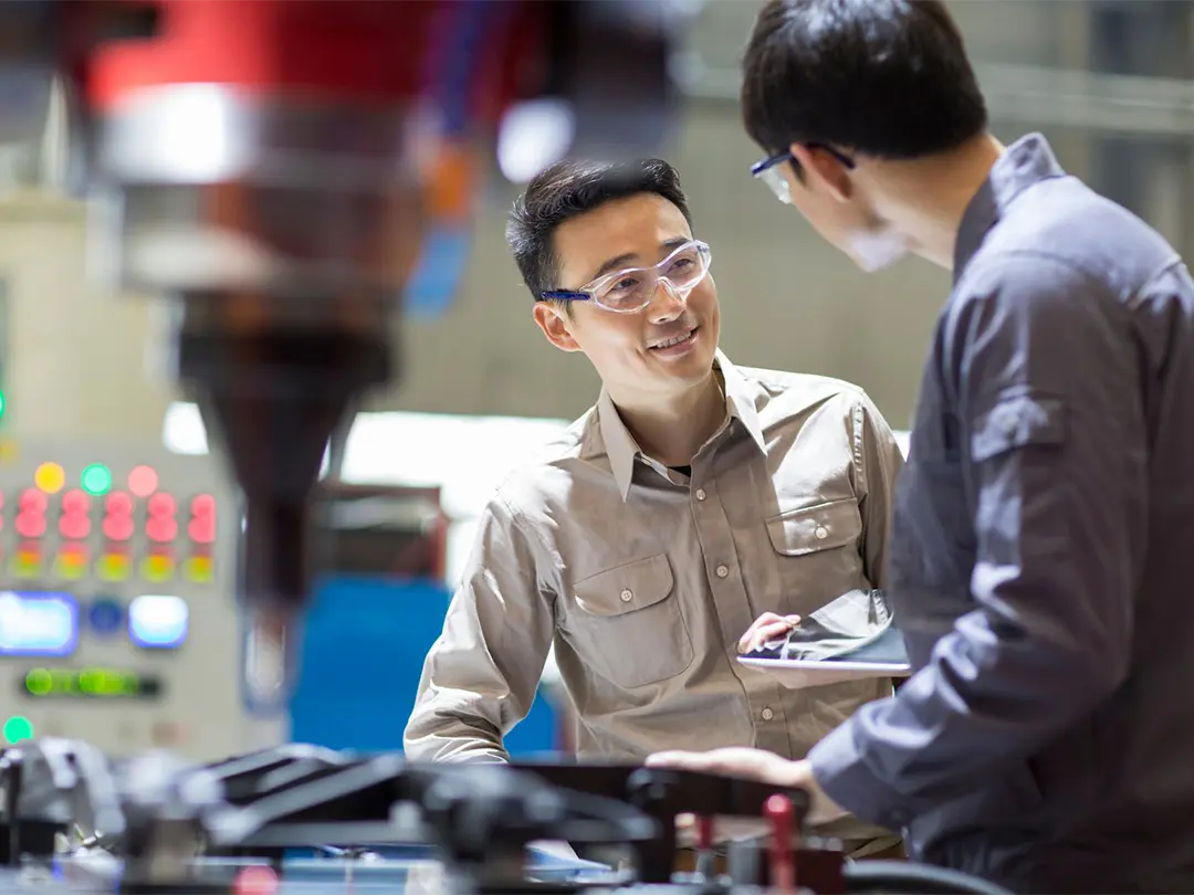 two service employees talking