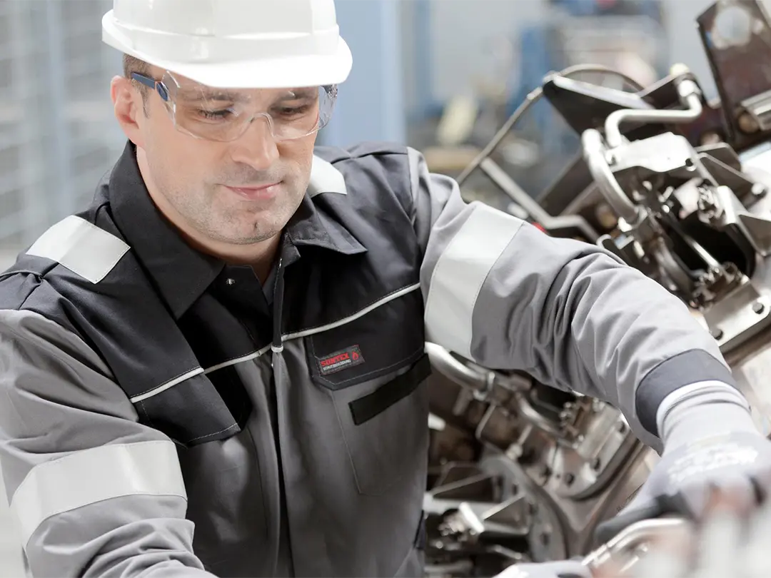 service employee working on an engine