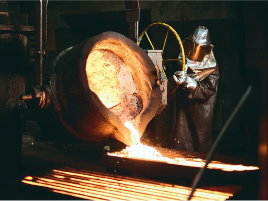 Foundry worker during casting