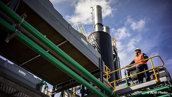 man standing at a power station