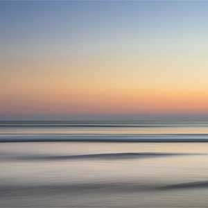 graphic of a sunset by the sea