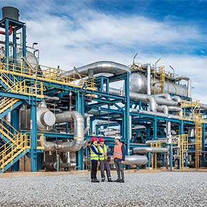 service engineers in front of industrial plant