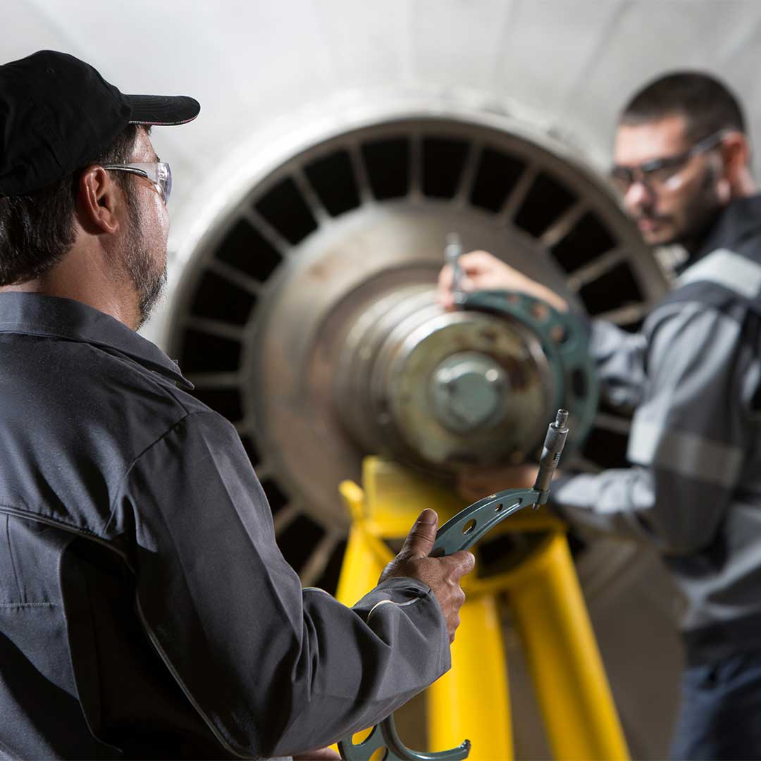 two service engineers checking a turbine