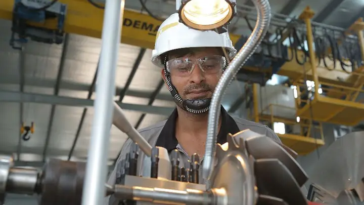 service employe working at an engine part