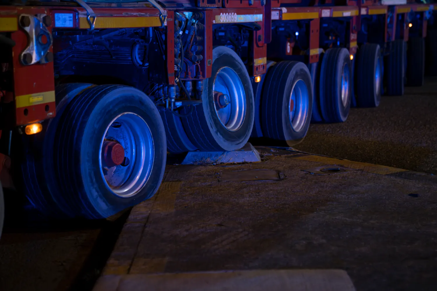 Close-up of multiple heavy-duty wheels supporting the transport load.