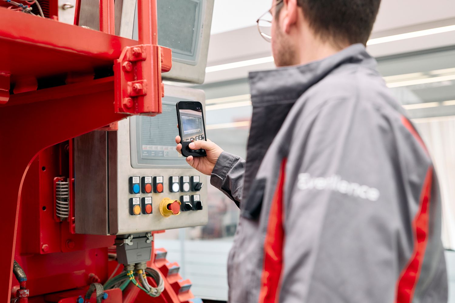 Technician taking a photo of an engine control panel to analyze an alarm using the CEON TechBot