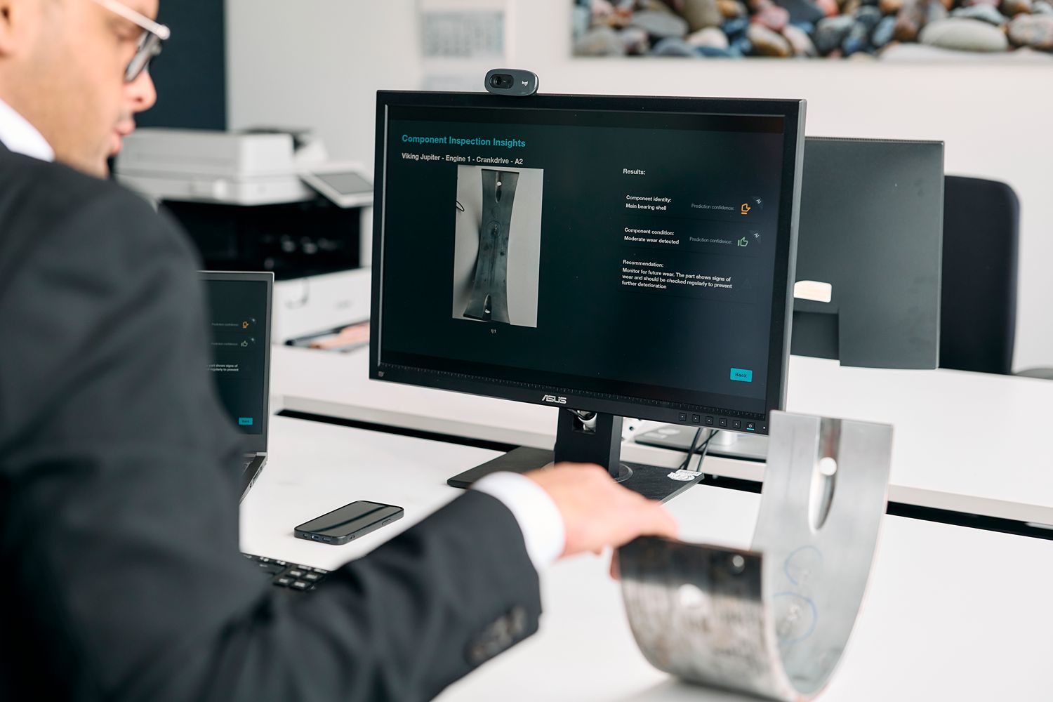 Everllence engineer evaluating AI‑based wear classification on a digital interface