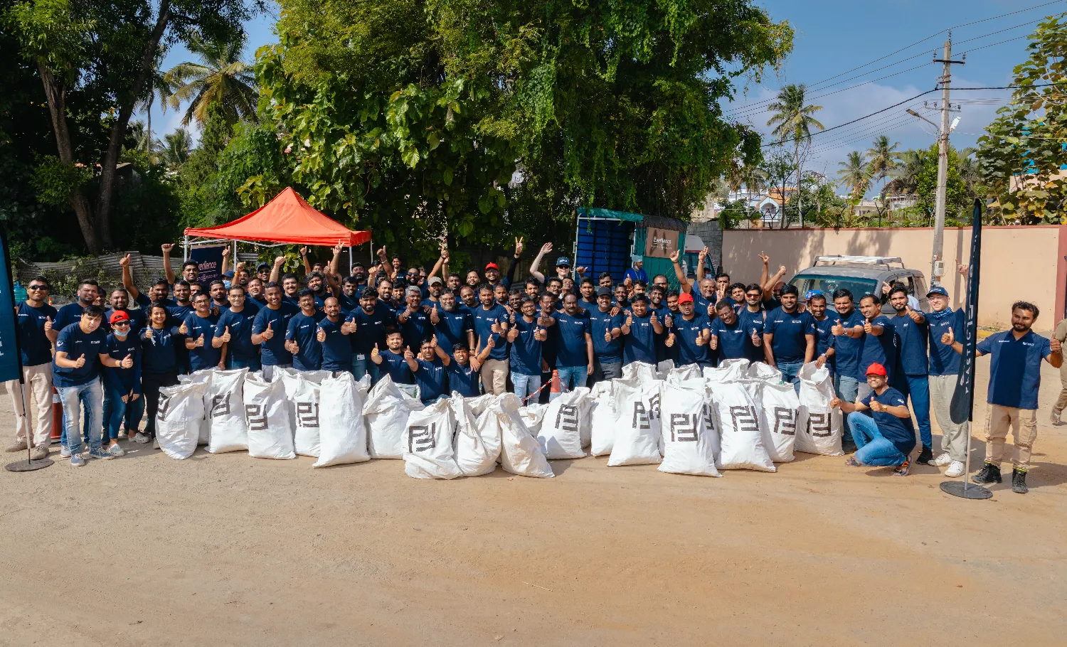 Large group of Everllence employees posing for a group photo after a clean-up action in Bengaluru, India.