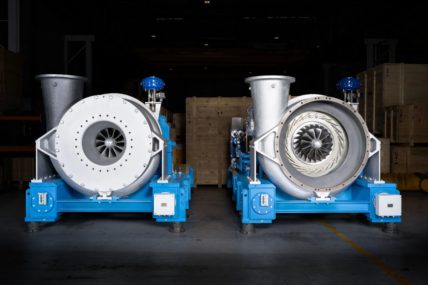 Two TURBAIR units positioned in an industrial hall for delivery.