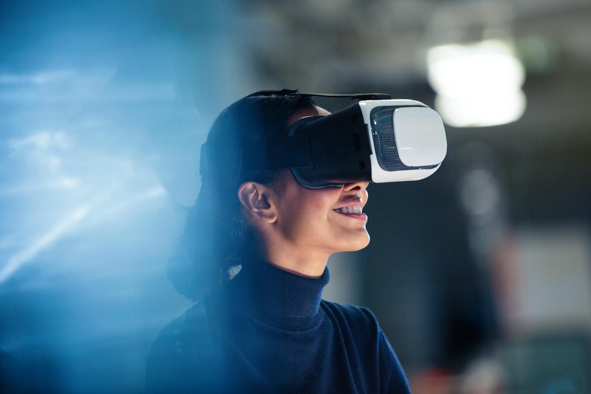 A female person wearing VR glasses