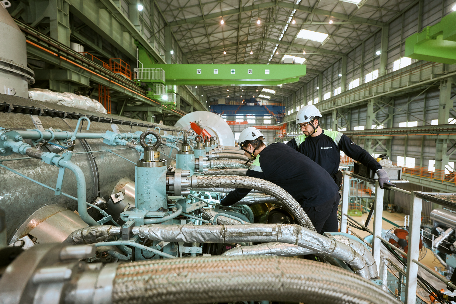 Workers Working on Engine