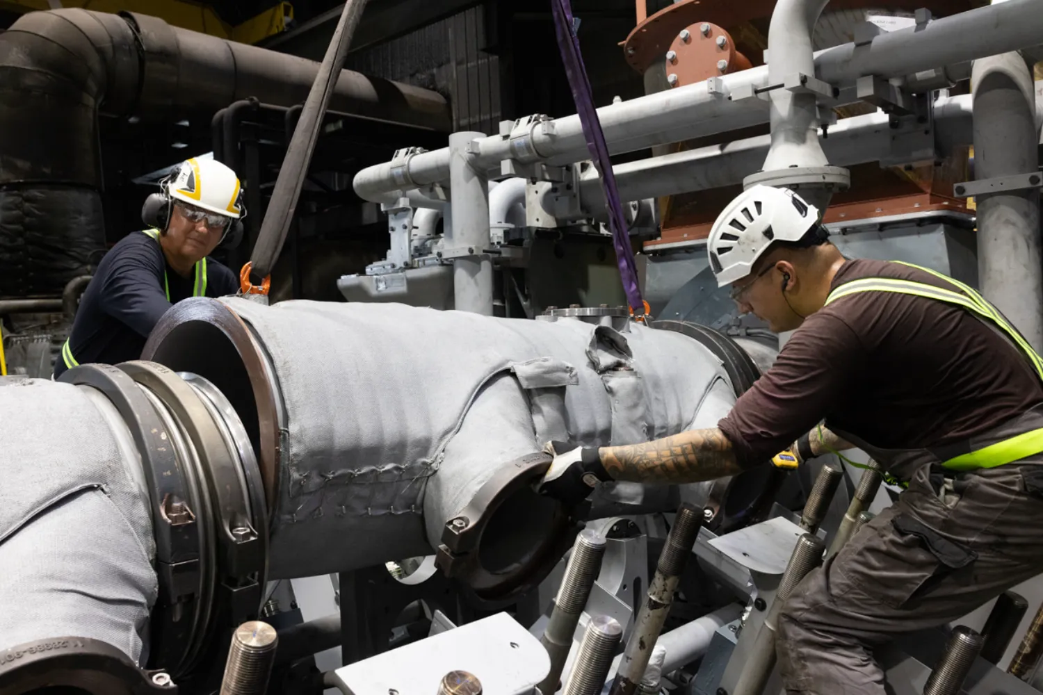Everllence PrimeServ engineers perform maintenance on large engine components during the Lifecycle Upgrade at the CUC power plant.