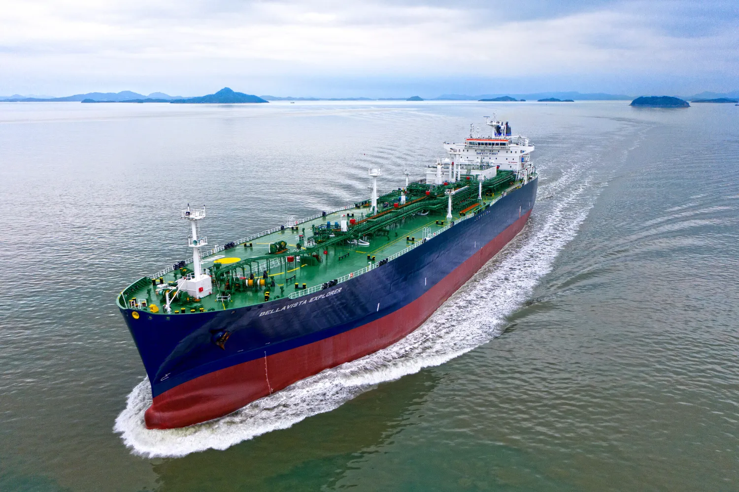 Aerial view of a large Trafigura cargo ship sailing through open waters, symbolizing the company’s global shipping operations and fuel transition efforts.