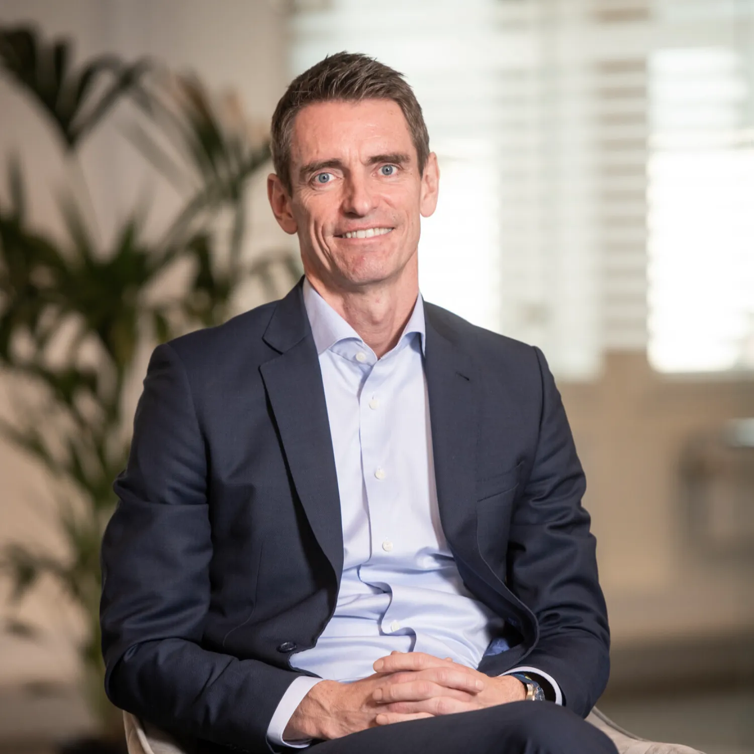 Aerial top-down view of a Trafigura container vessel loaded with cargo, highlighting the scale of international shipping and fuel efficiency potential.