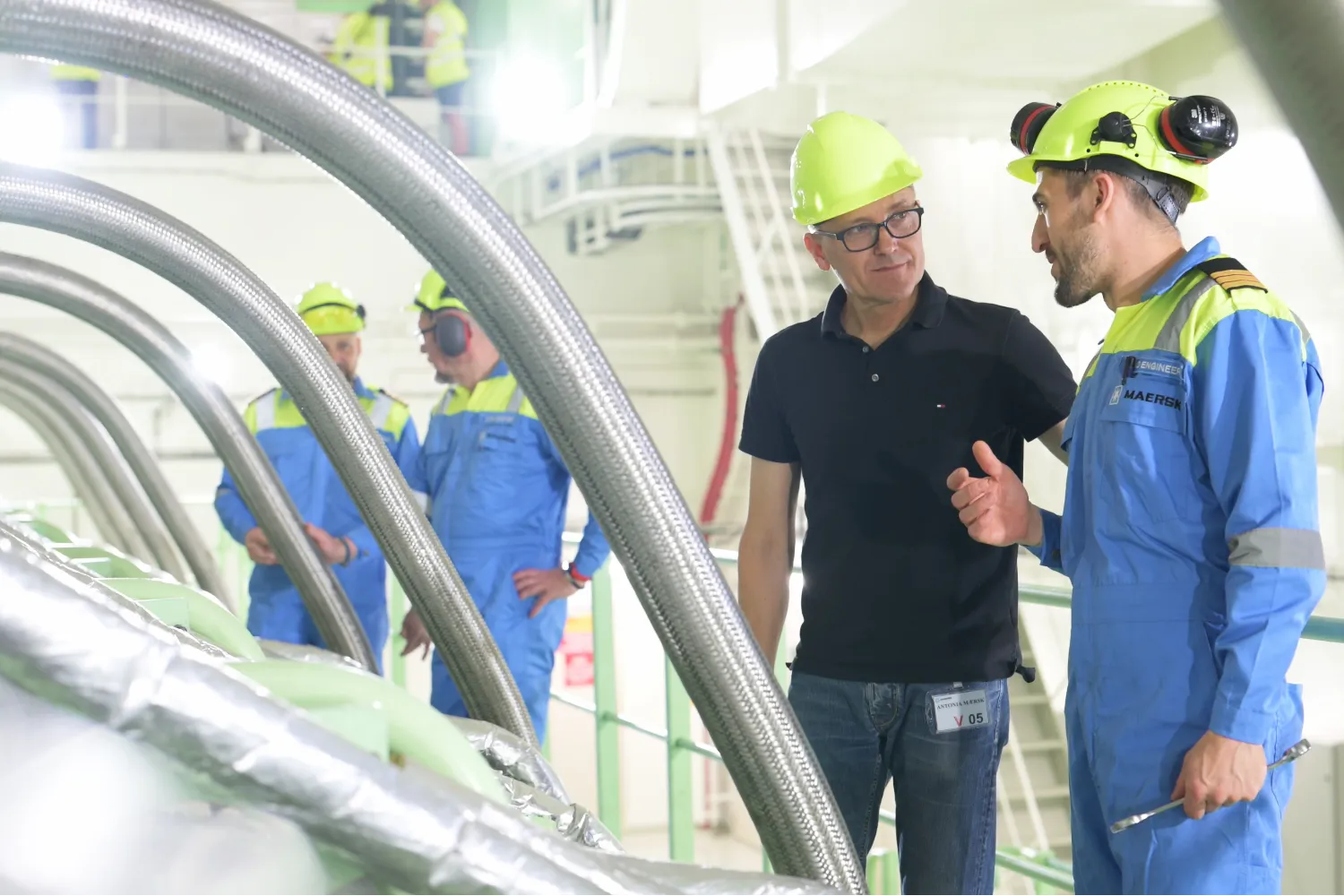 Everllence’s Thomas Hansen and 2nd Engineer Oleg Zubkov discuss the methanol engine aboard the Antonia Mærsk.