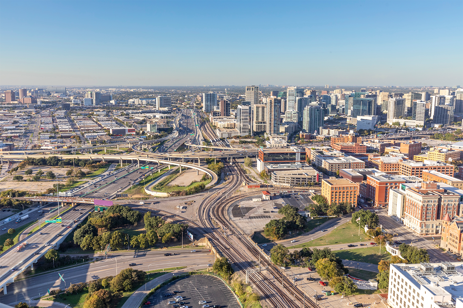 Aerial photo of a large industrial power plant in Texas with several rectangular buildings, tanks, and outdoor equipment