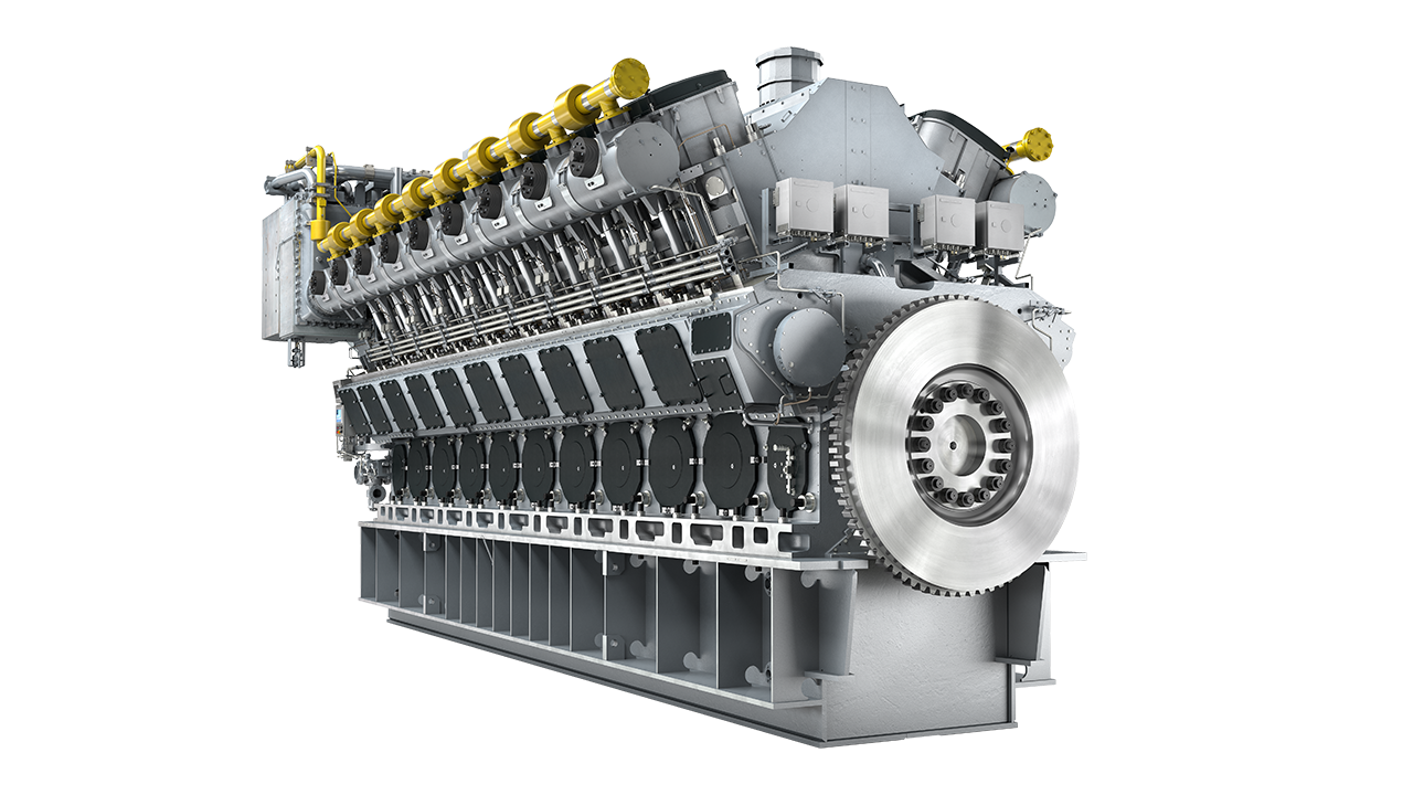 Large industrial multi-cylinder engine with visible injectors and flywheel