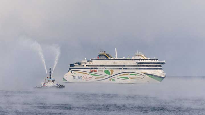 cruise ship and work boat on the ocean