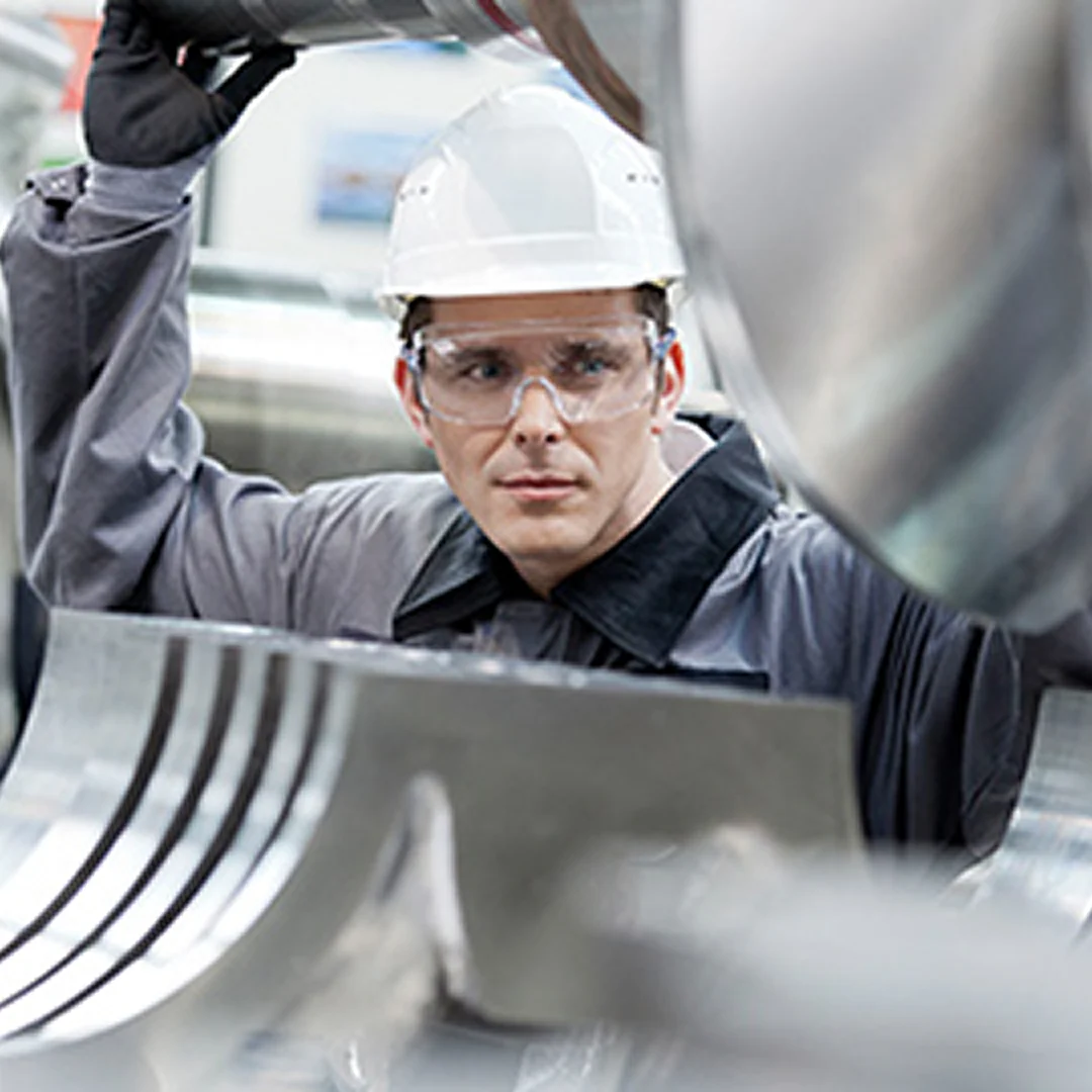Technician installing a turbocharger component