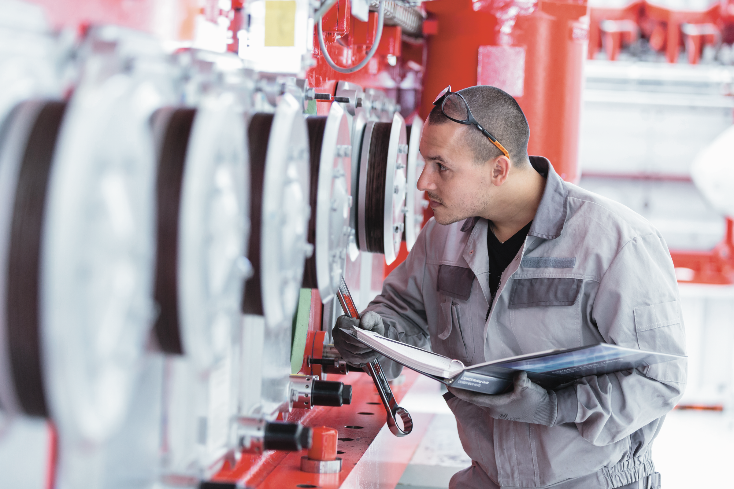 man standing in front of an engine 
