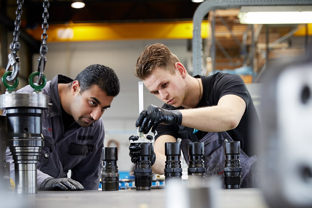 two service engineers working on an engine