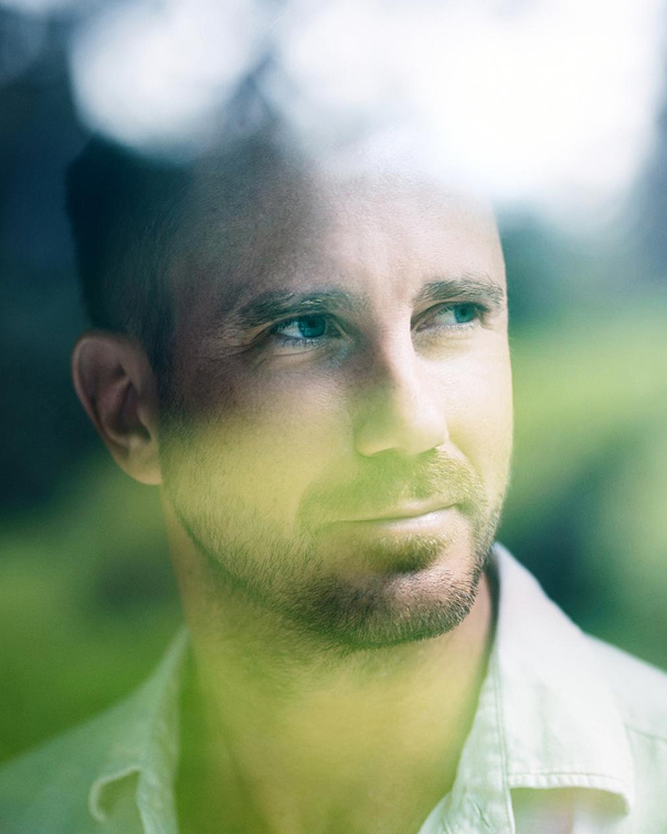 Close-up of a man in green light