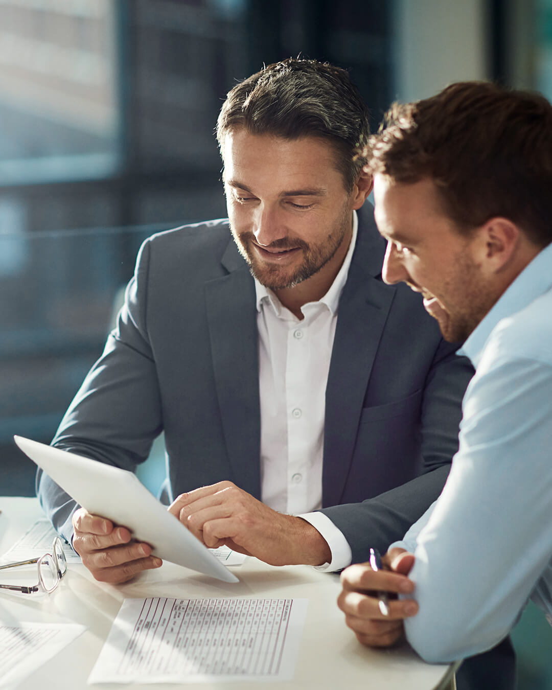 two office people looking at a document